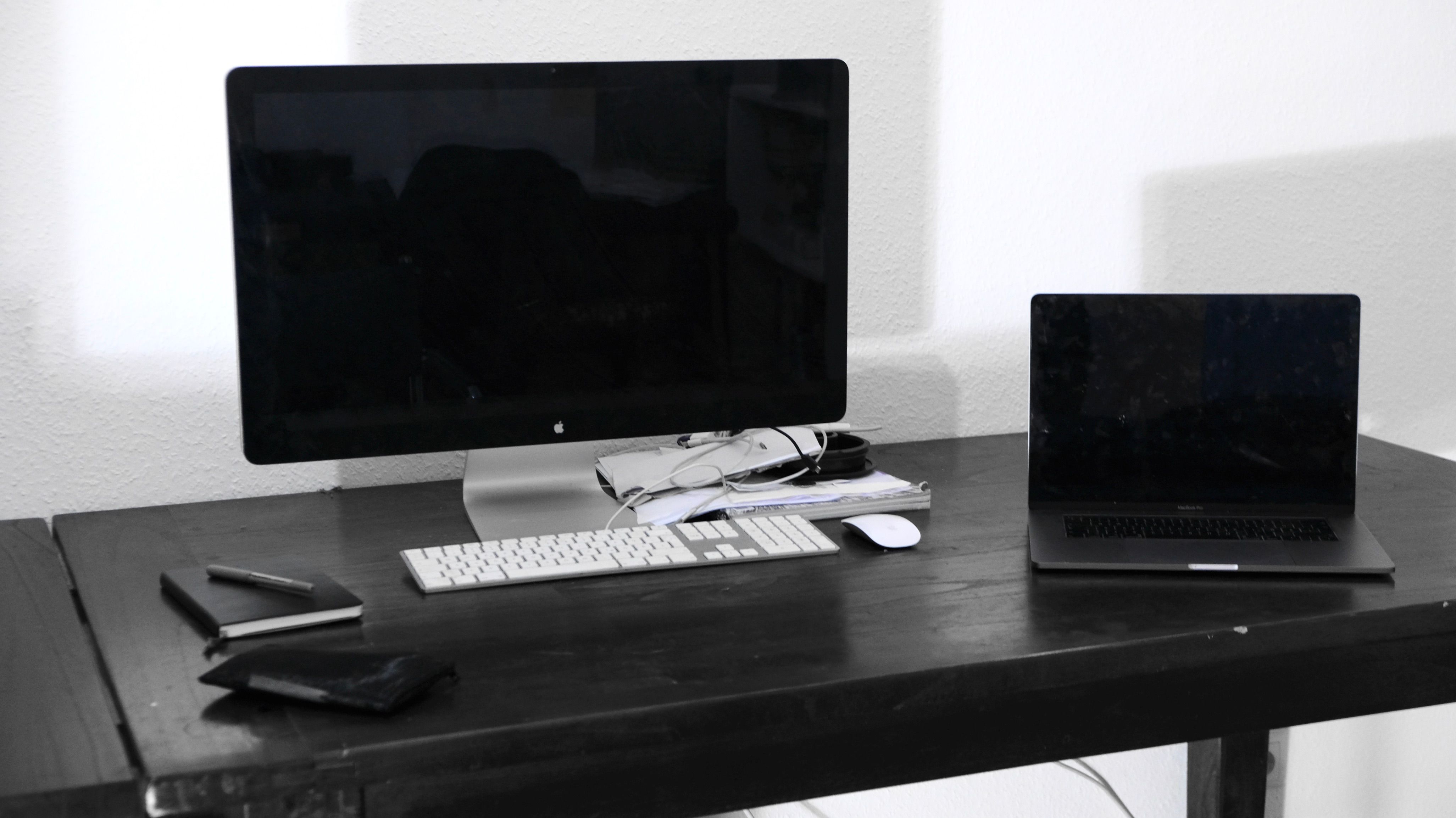 Desktop computer and laptop on an office desk, representing business computer replacement and upgrades for Cincinnati businesses.