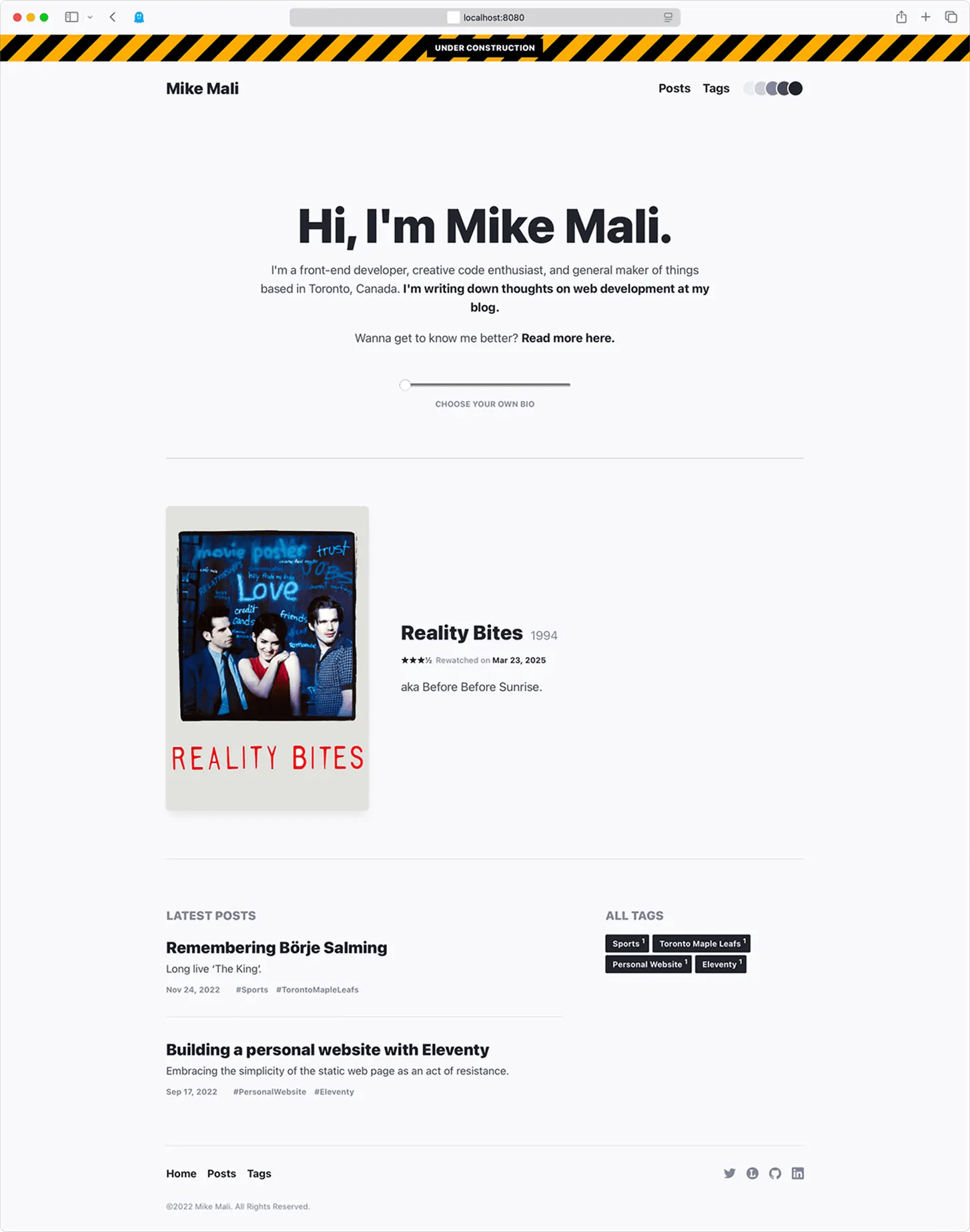 A screenshot of an earlier version of this site circa 2023. It has a more refined, subdued design this time, with a mix of light & dark greys. It has a similar layout, with an introduction and a post list containing two posts, although this iteration also includes a dynamic section showing the last Letterboxd review I had made.