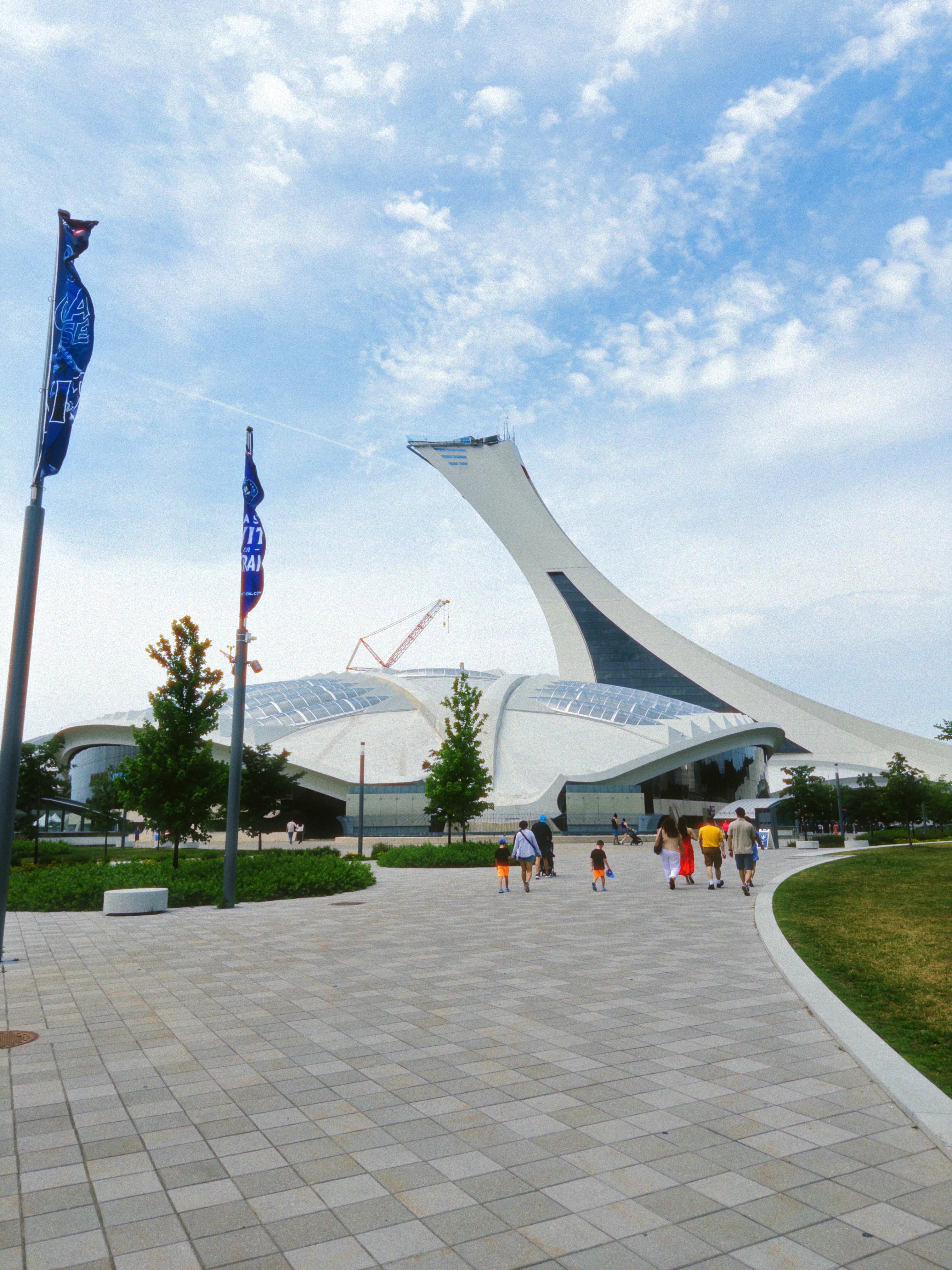 The exterior of the Montréal Biodome, an old-velodrome olympic venue turned into an educational zoo with four different environments. Montréals infamous Olympic stadium is visible in the background.
