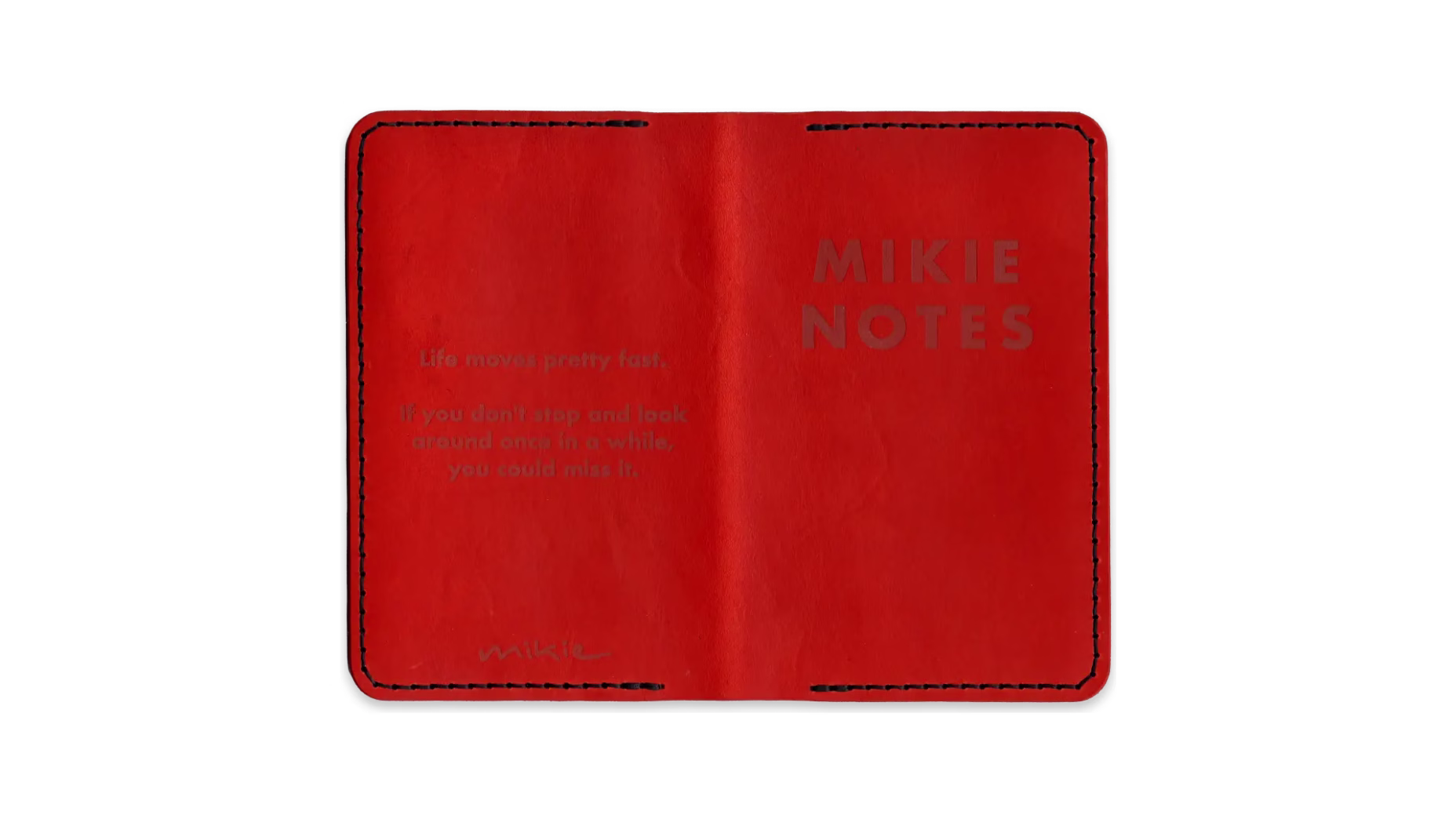 A scanned image of a one-of-a-kind pocket notebook leather folio, in orange with black thread.