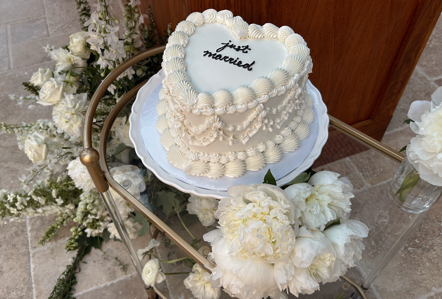 White heart wedding cake and white florals