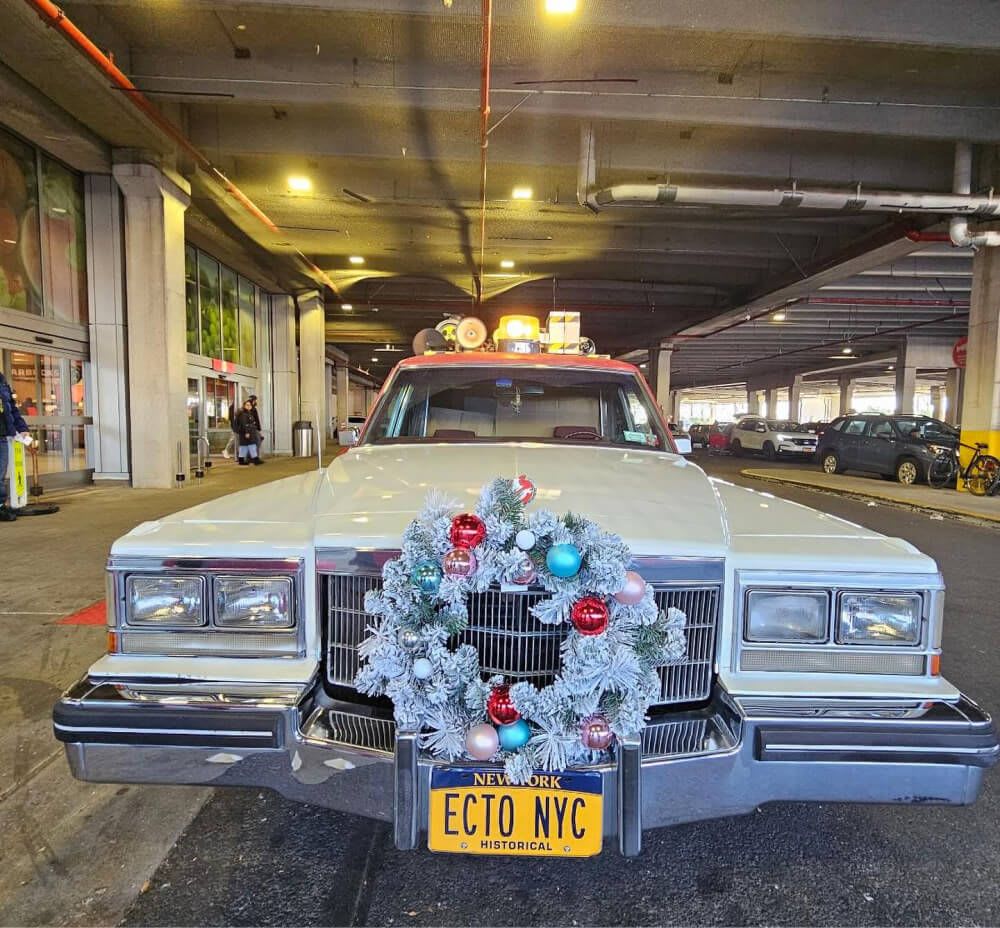 ECTO NYC in the holiday spirit with a Christmas wreath on the grill of the car, 2023