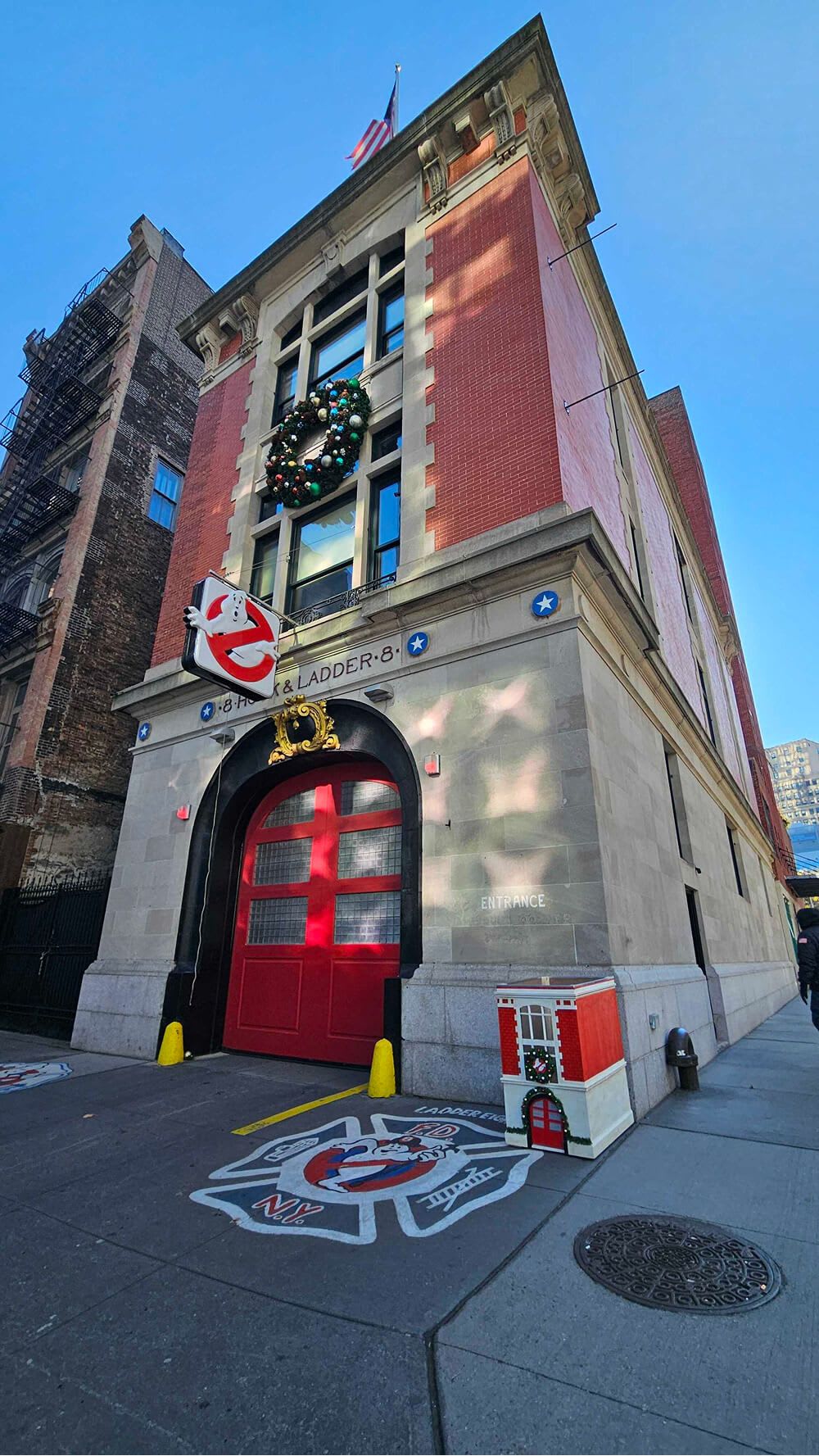 The behemoth that is Hook & Ladder 8 next to a smaller replica toy drive collection box