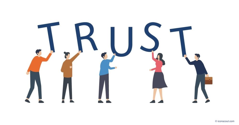 Menschen-die-TRUST-in-die-Hoehe-halten