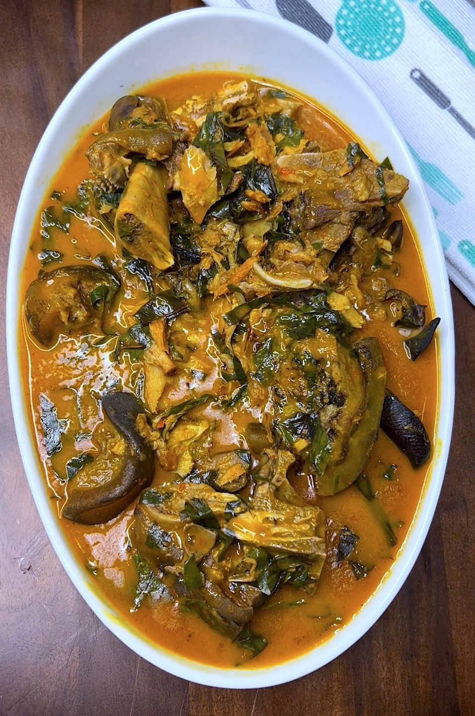 Bitter Leaf Soup (Ofe Onugbu) with Fufu (Cassava Swallows) and Dried Fish