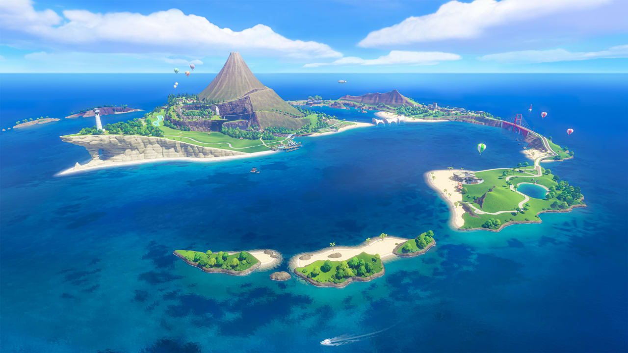 Vista aérea da Ilha Wuhu em Nintendo Switch Sports Resort, com o vulcão no centro, o farol, a ponte vermelha, o campo de golfe e ilhotas cercadas de mar azul