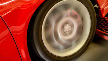 Tire on red car spinning on the dyno