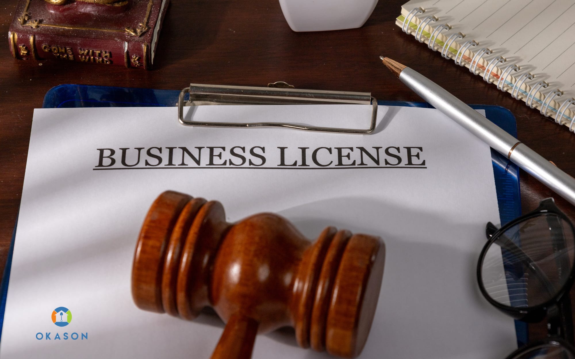 Landscaping crew leader reviewing license paperwork outside a residential property