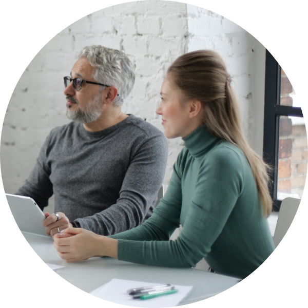 image of two people; one man and one woman in a meeting