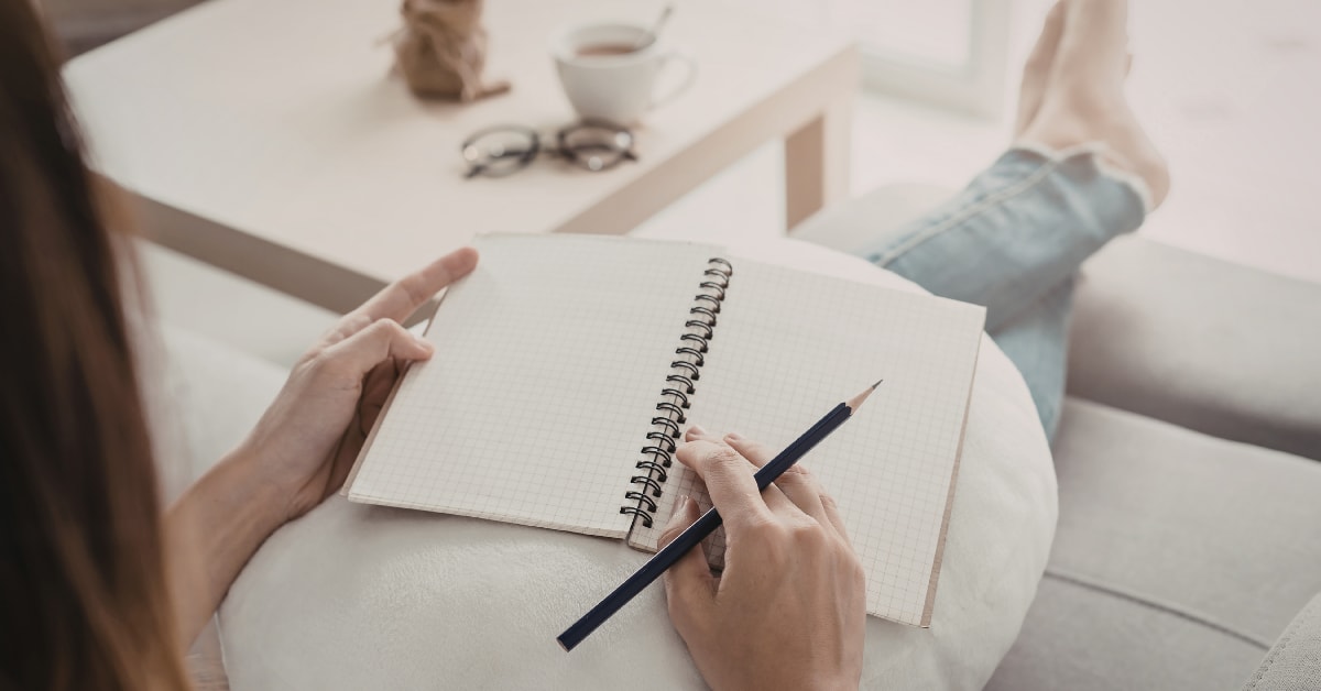 Open notebook on a warm desk — Spanish grammar hub with every topic organized in one place