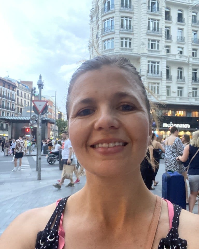Señora Havana, founder of Grow Spanish, smiling on a street in Madrid