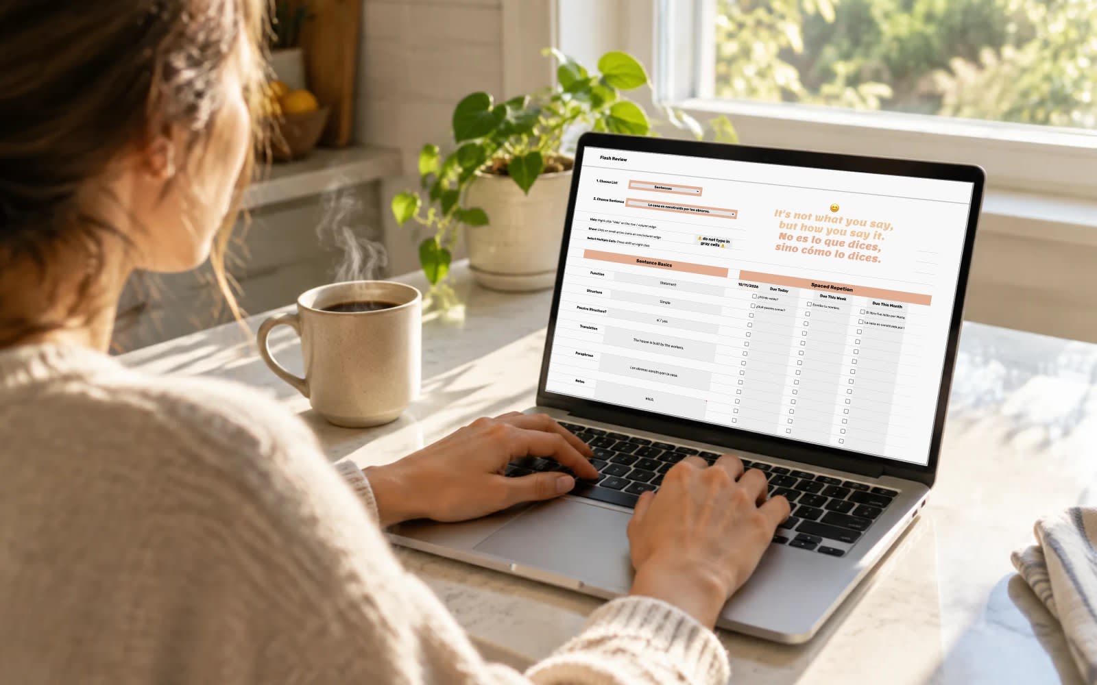 Learner running a Flash Review on a laptop at a sunny kitchen counter with morning coffee