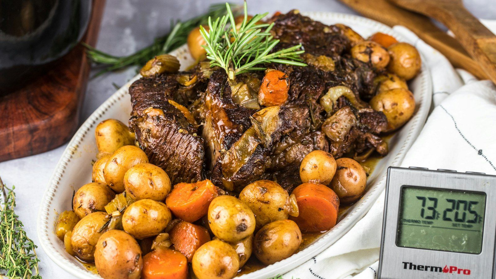 An easy slow cooker pot roast recipe for fall served with tender vegetables in a bowl
