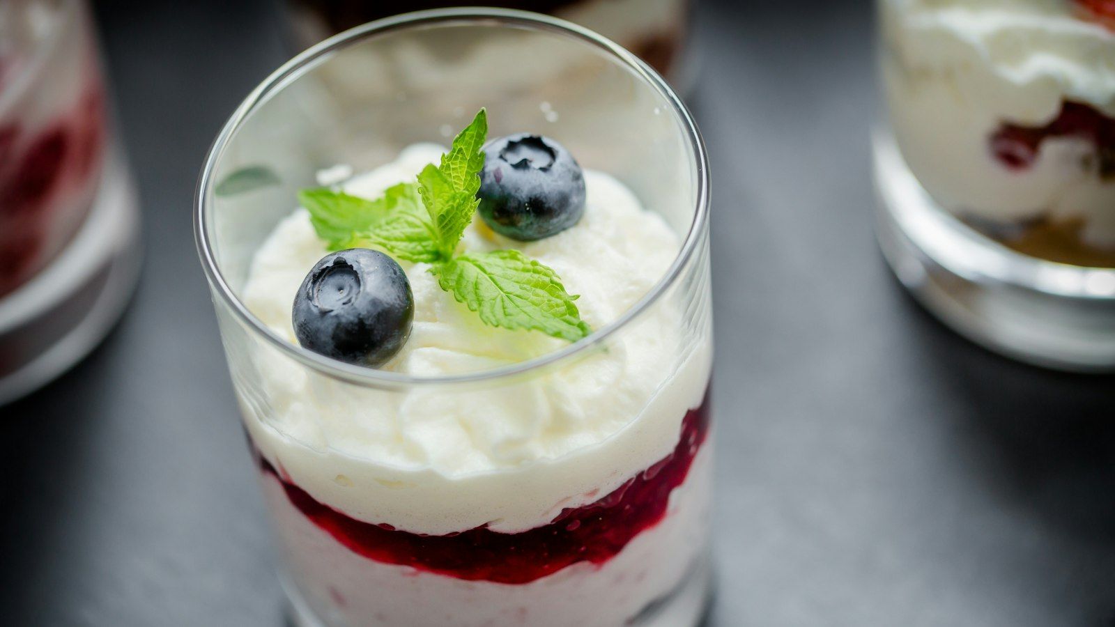 Creamy layered dessert glass showcasing easy no-bake dessert recipes with cream cheese