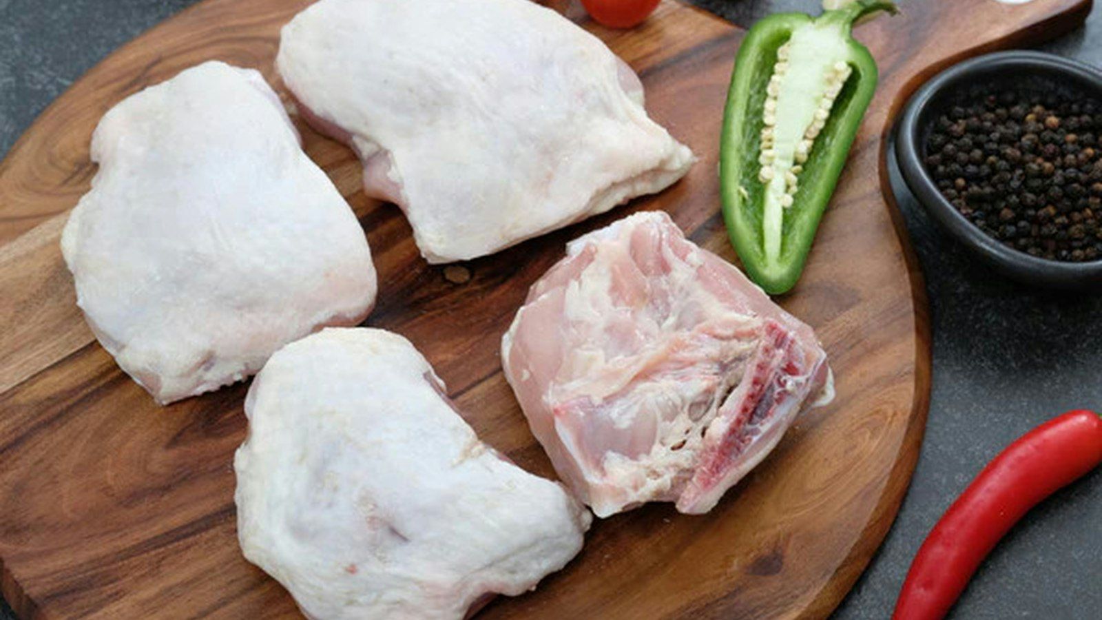 Golden brown pressure cooked chicken thighs garnished with fresh herbs on a plate