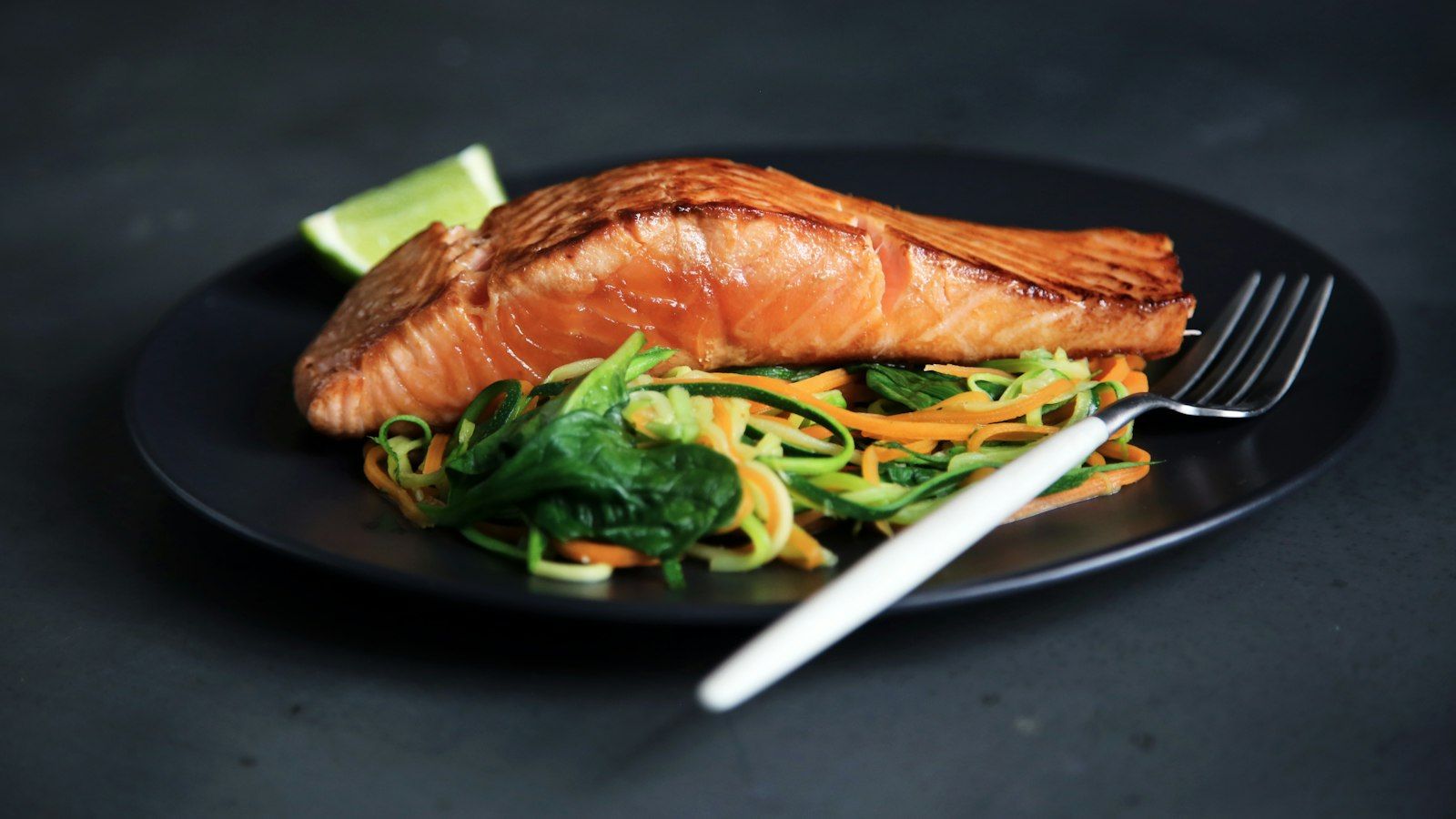 Two plates of pan seared salmon for an easy seafood dinner for two