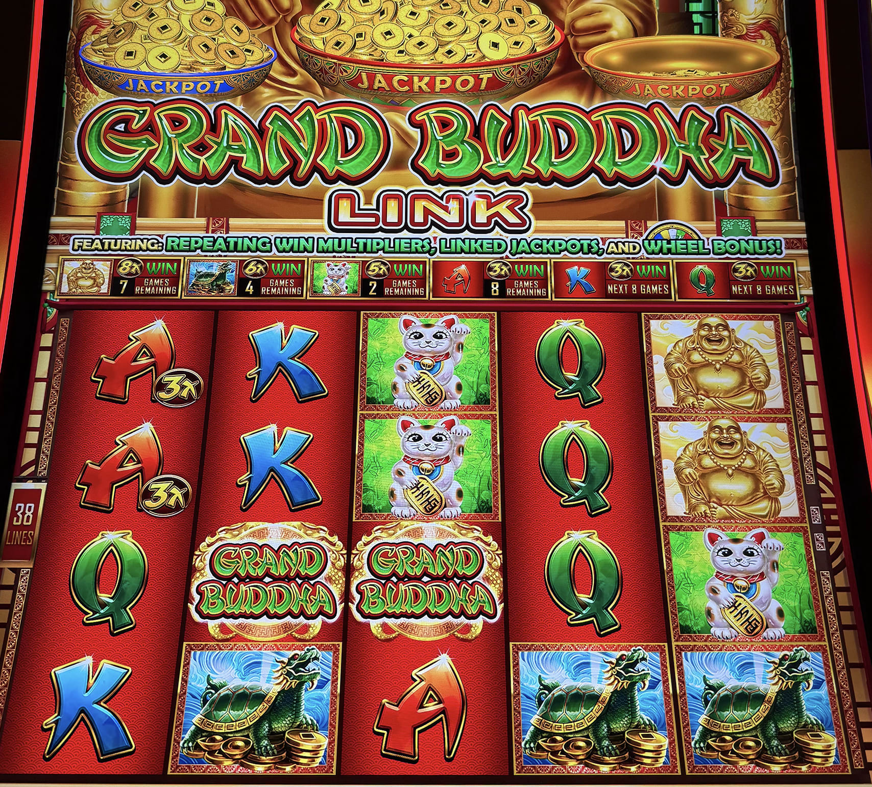 Grand Buddha Link or Grand Cat Link slot machine
