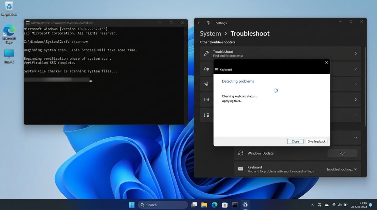 Windows Command Prompt running SFC scan next to keyboard troubleshooter dialog