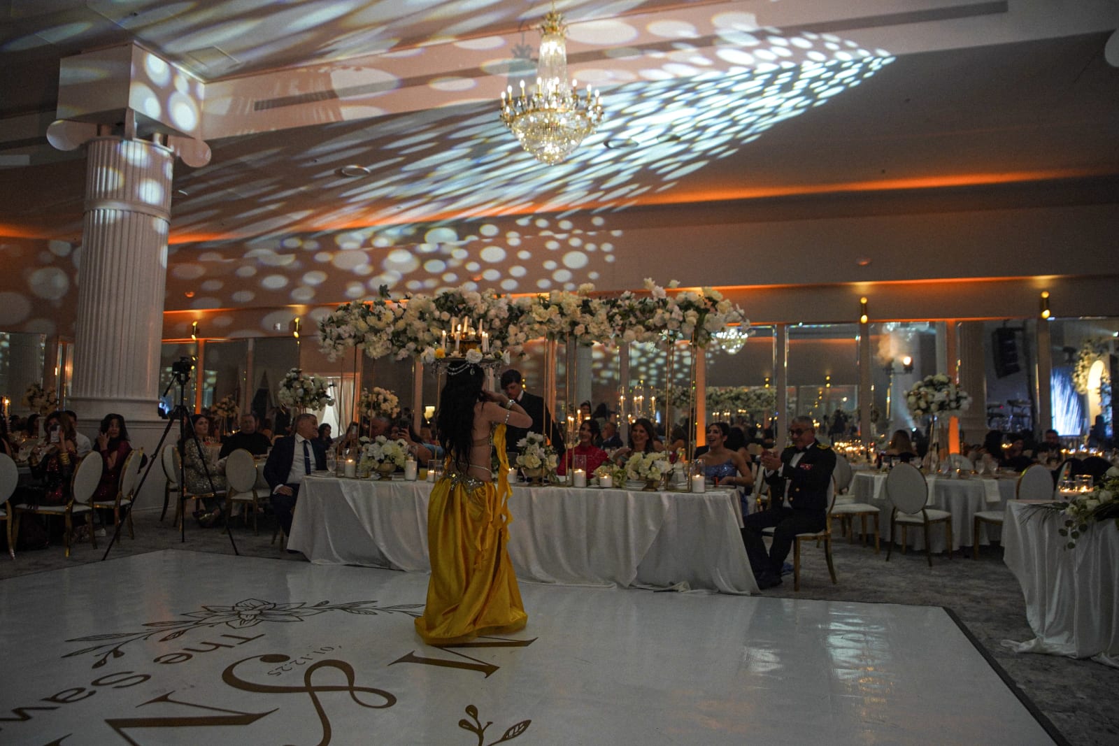 Güzel performing at a wedding reception