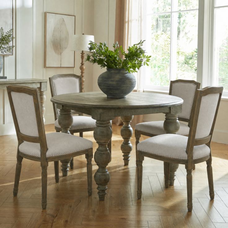 Ripley Grey Dining Chair with grey woven fabric seat and washed rubberwood frame with hand-carved details.