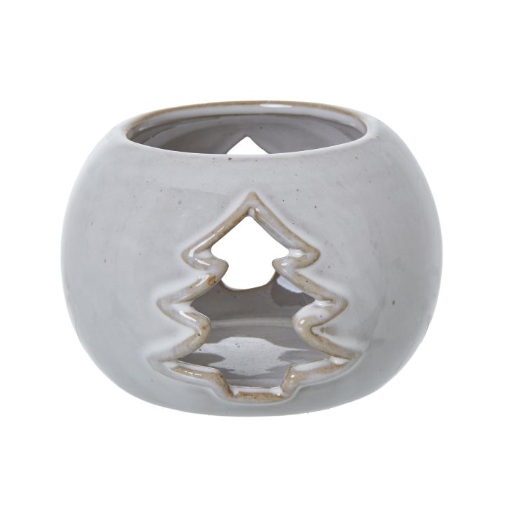 White round ceramic tealight holder with a delicate tree cut-out design and glazed finish.