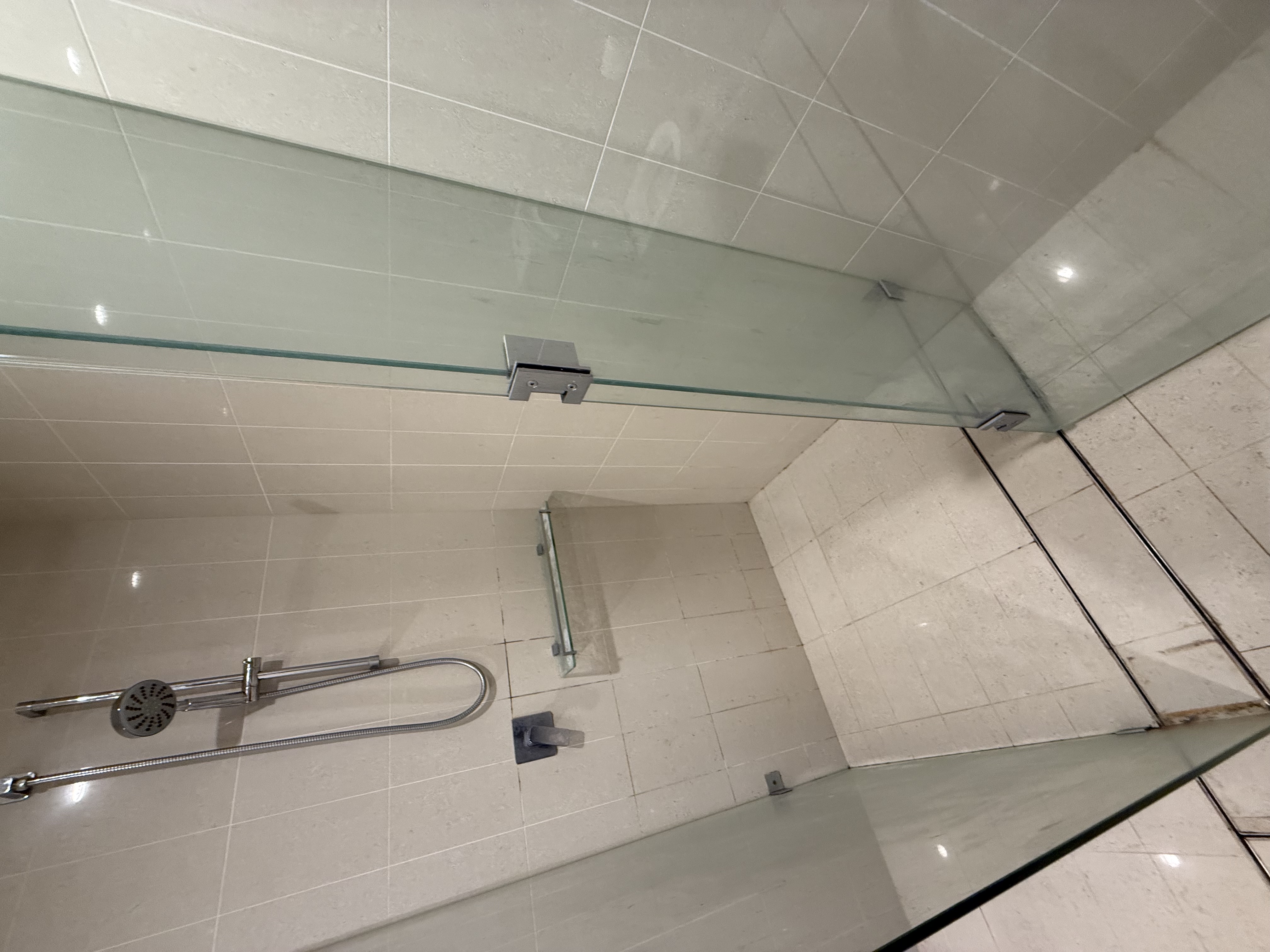 Shower glass before end of lease clean — soap scum and water marks