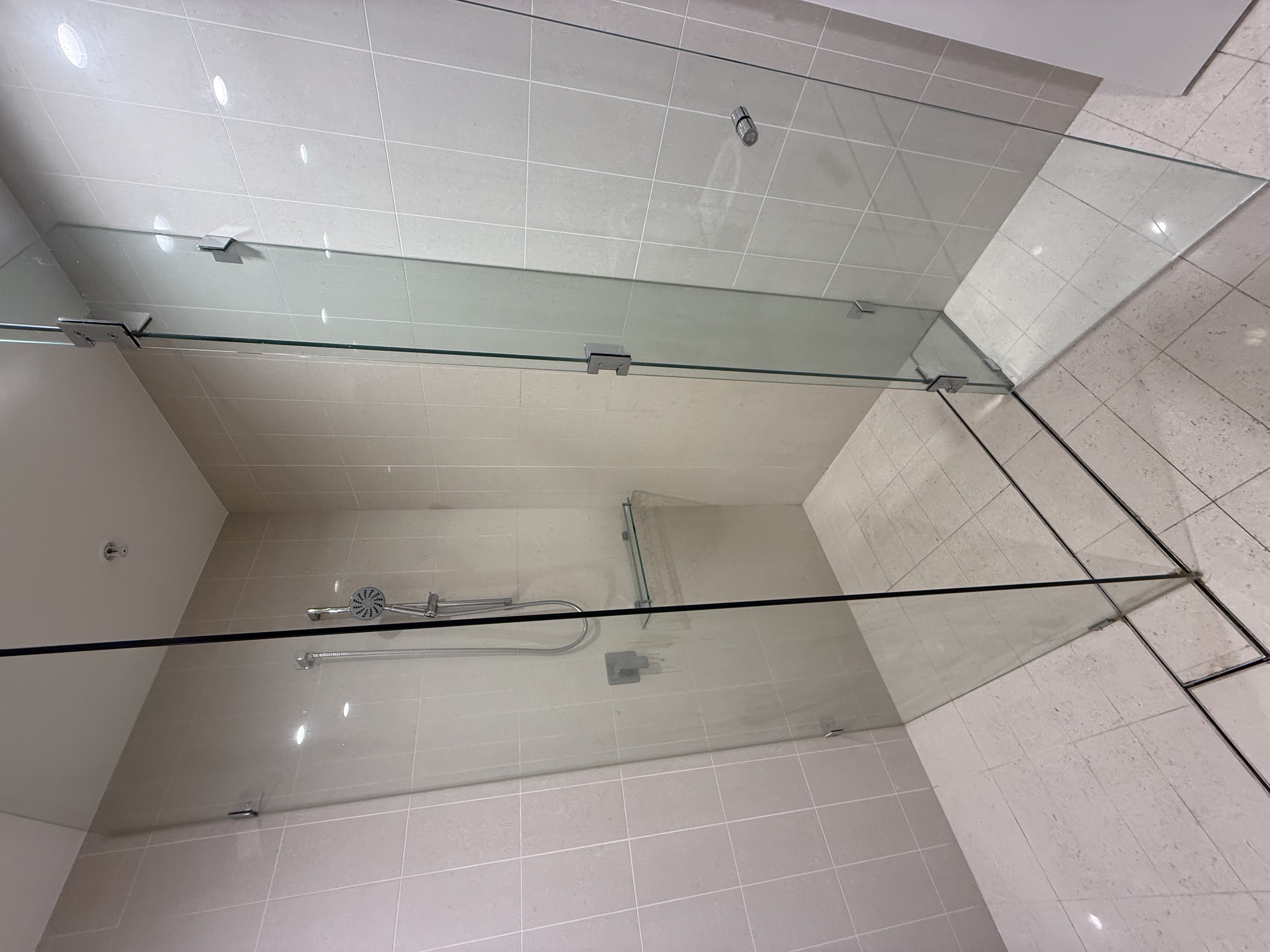 Shower glass after end of lease clean — crystal clear