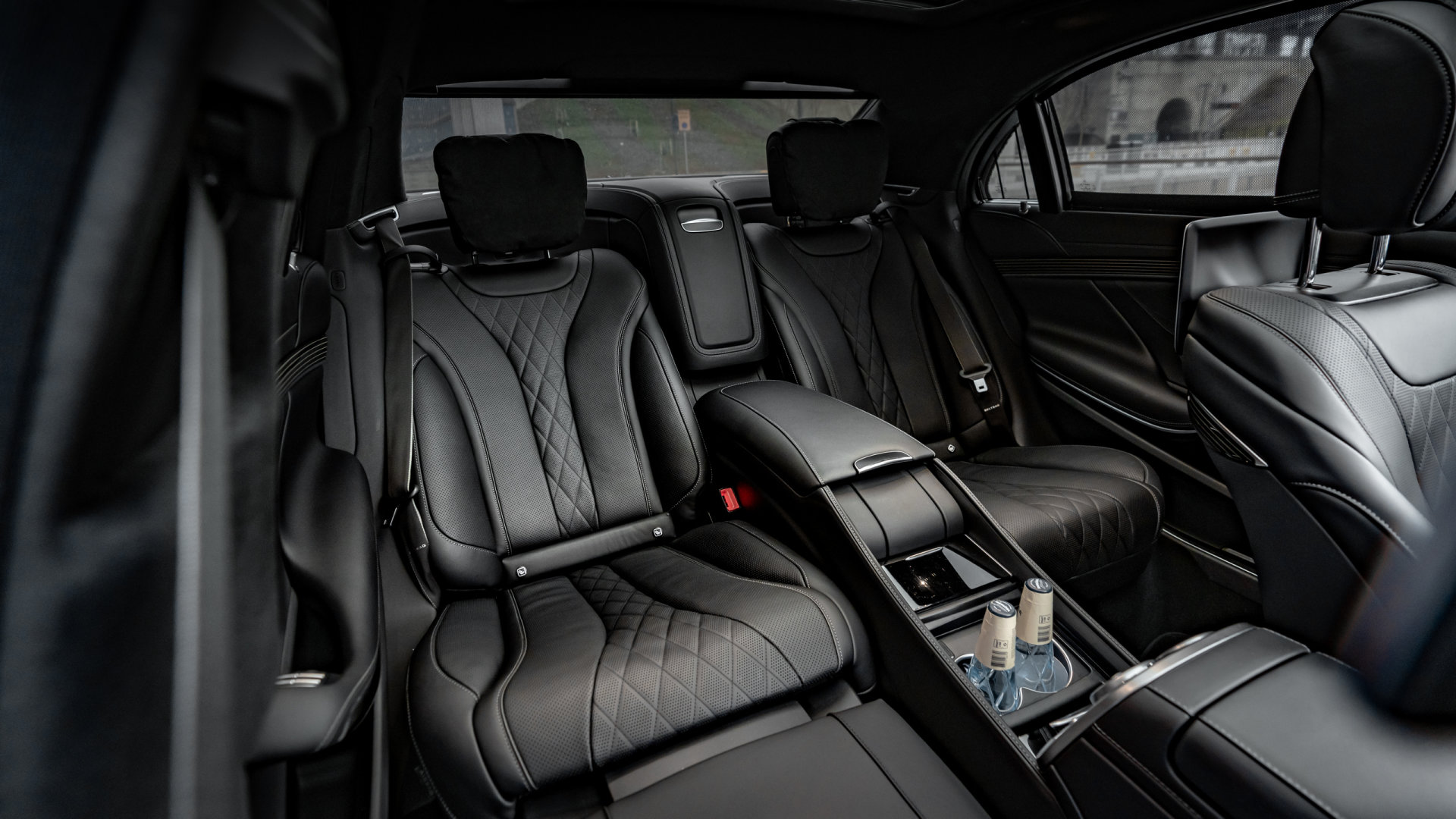 Mr Charles chauffeur beside a black Mercedes limousine, ready for a Bromma airport transfer