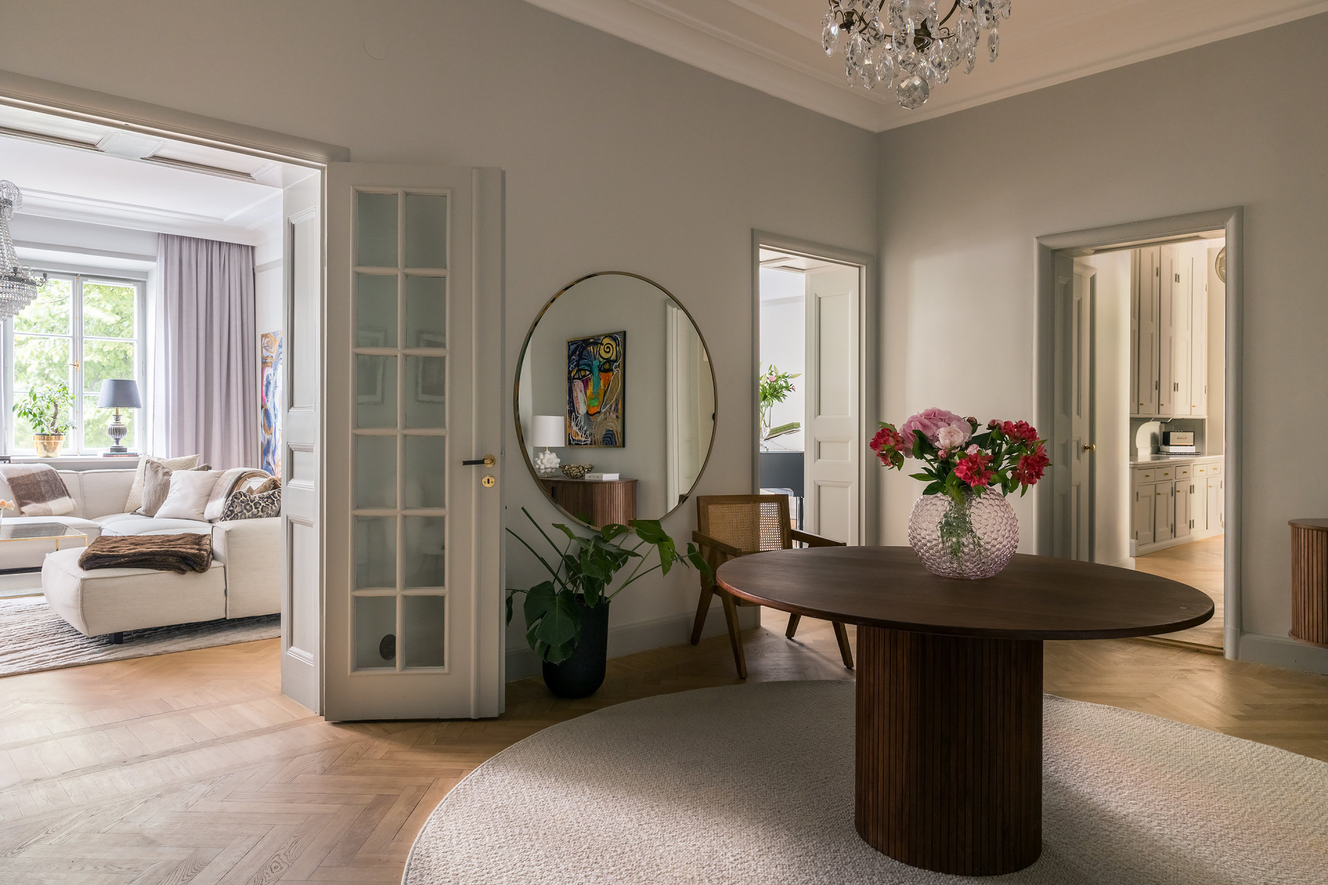 Charles Maison II grand entrance hall with seating and large table