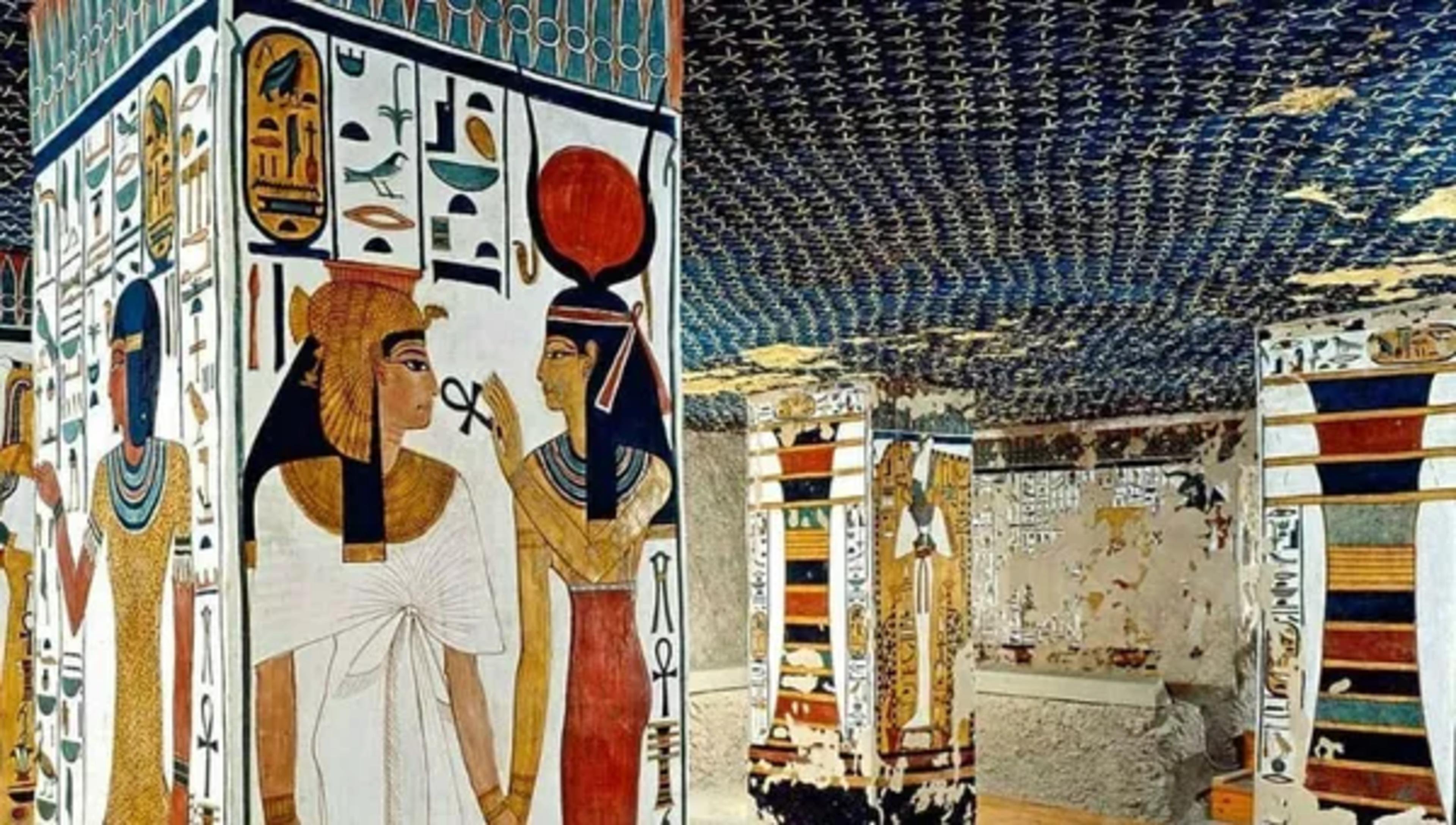 Interior of the tomb of Nefertari in the Valley of the Queens, with a painted column showing Queen Nefertari led by the goddess Isis beneath a vaulted ceiling of golden stars on indigo.
