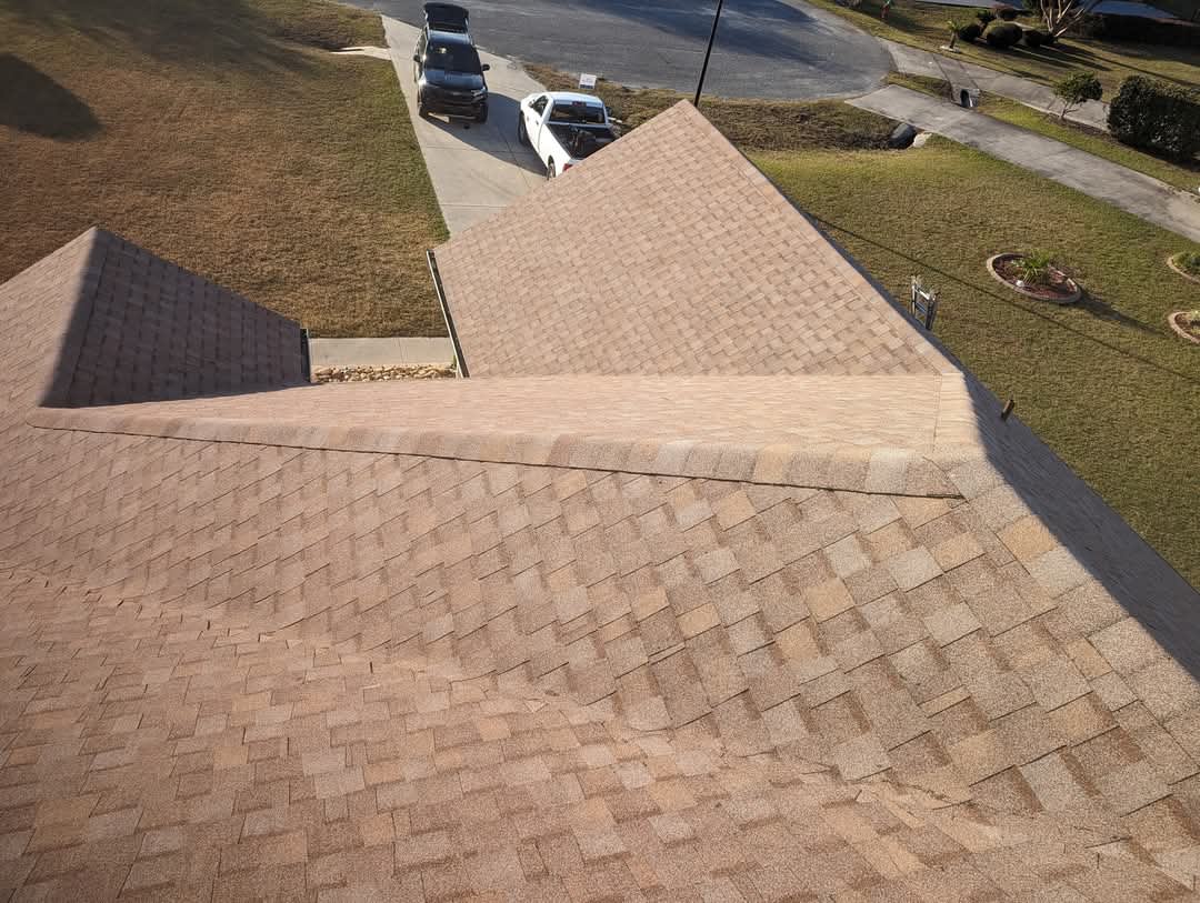 Residential roofing project with clean ridge cap installation