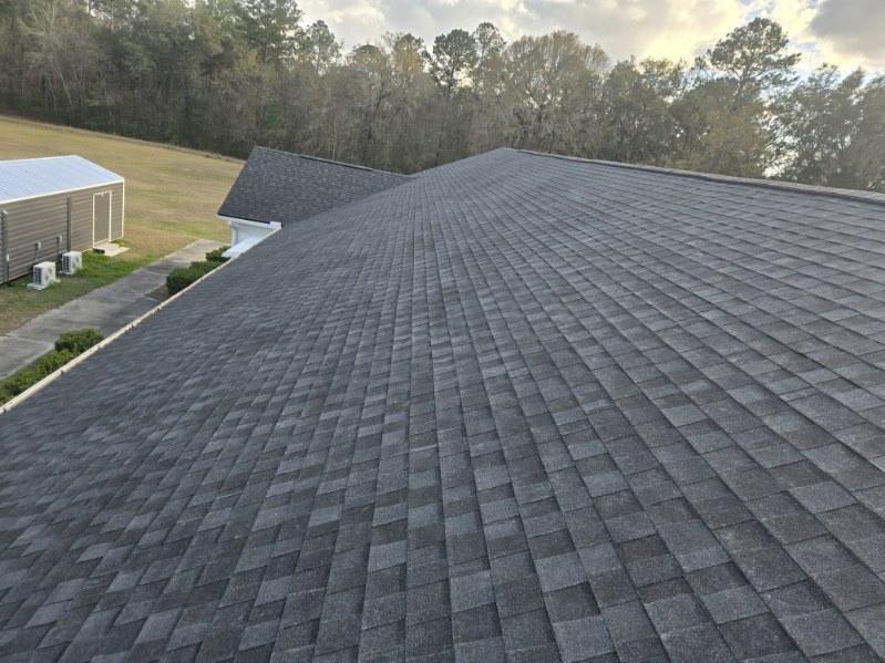 Residential roofing project showing clean ridge lines and flashing