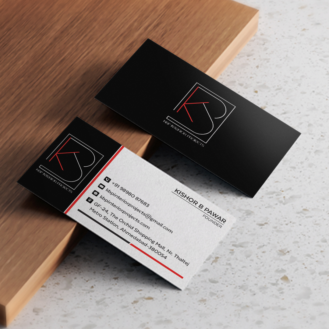 Business card design mockup for Kishor B Dawar on a wooden surface