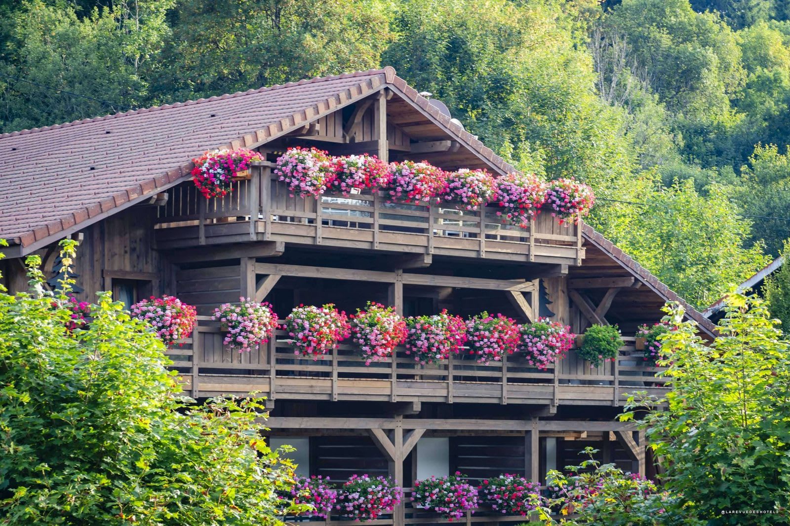 The flower-filled facade of Les Bas Rupts, on the Route de La Bresse