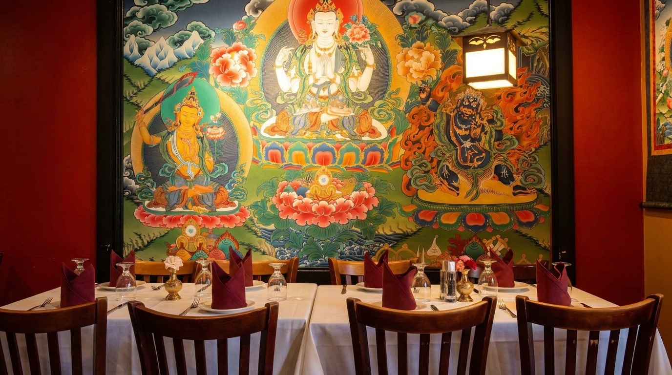 Restaurant dining room with tables set against a vibrant, colorful mural depicting Buddhist deities.
