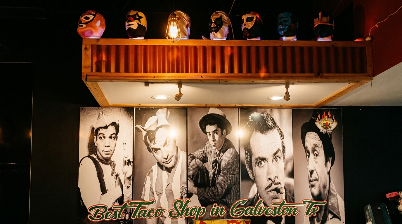 Lucha libre masks on a shelf above black and white portraits of men, with "Best Taco Shop in Galveston Tx" text.