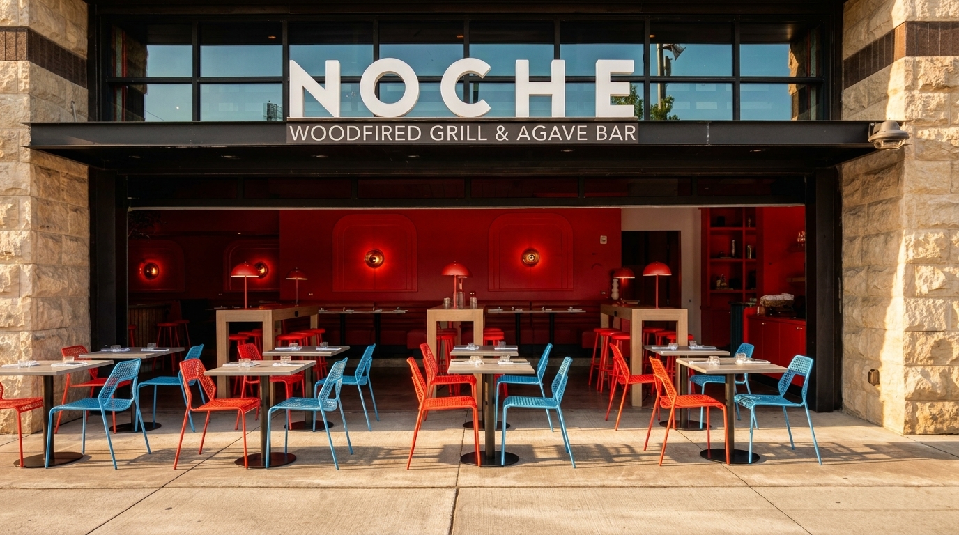 Noche Woodfired Grill & Agave Bar exterior with red and blue patio seating, and a vibrant red interior.