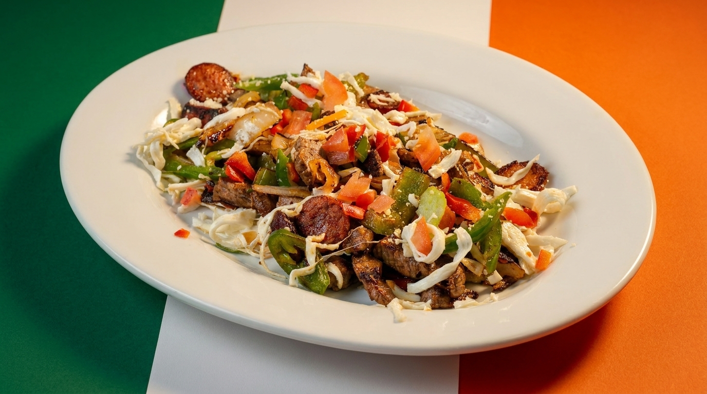 A white oval plate filled with a colorful stir-fry of meat, peppers, and cabbage.