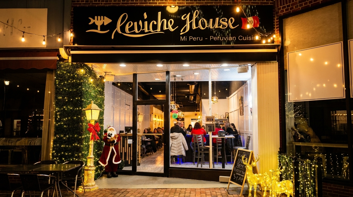 Exterior of Ceviche House restaurant at night, decorated with festive lights and a Santa statue.
