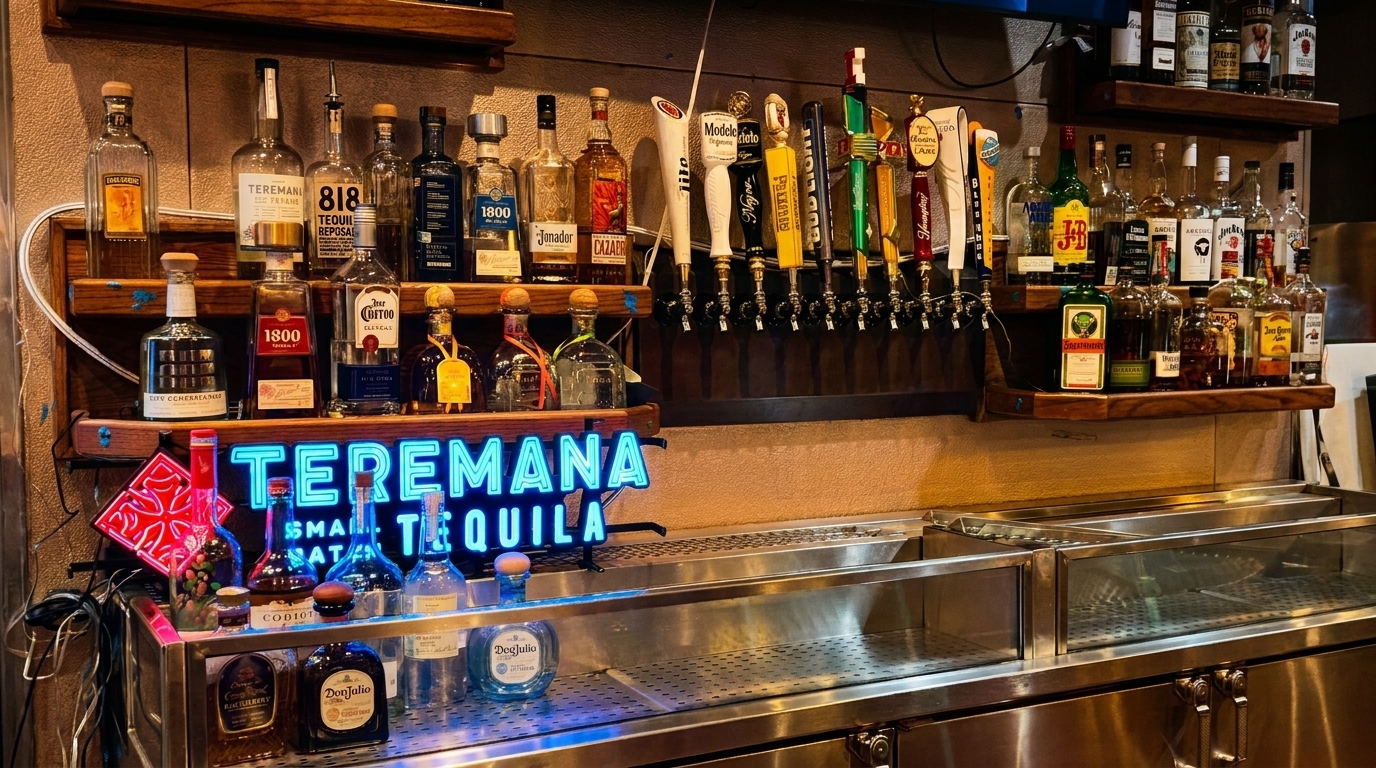 A well-stocked bar with various tequila bottles, beer taps, and a glowing "Teremana Tequila" sign.