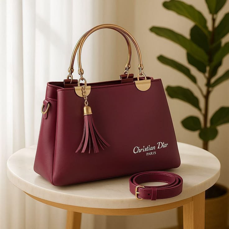 Elegant Maroon Top-Handle Handbag with Gold-Toned Hardware