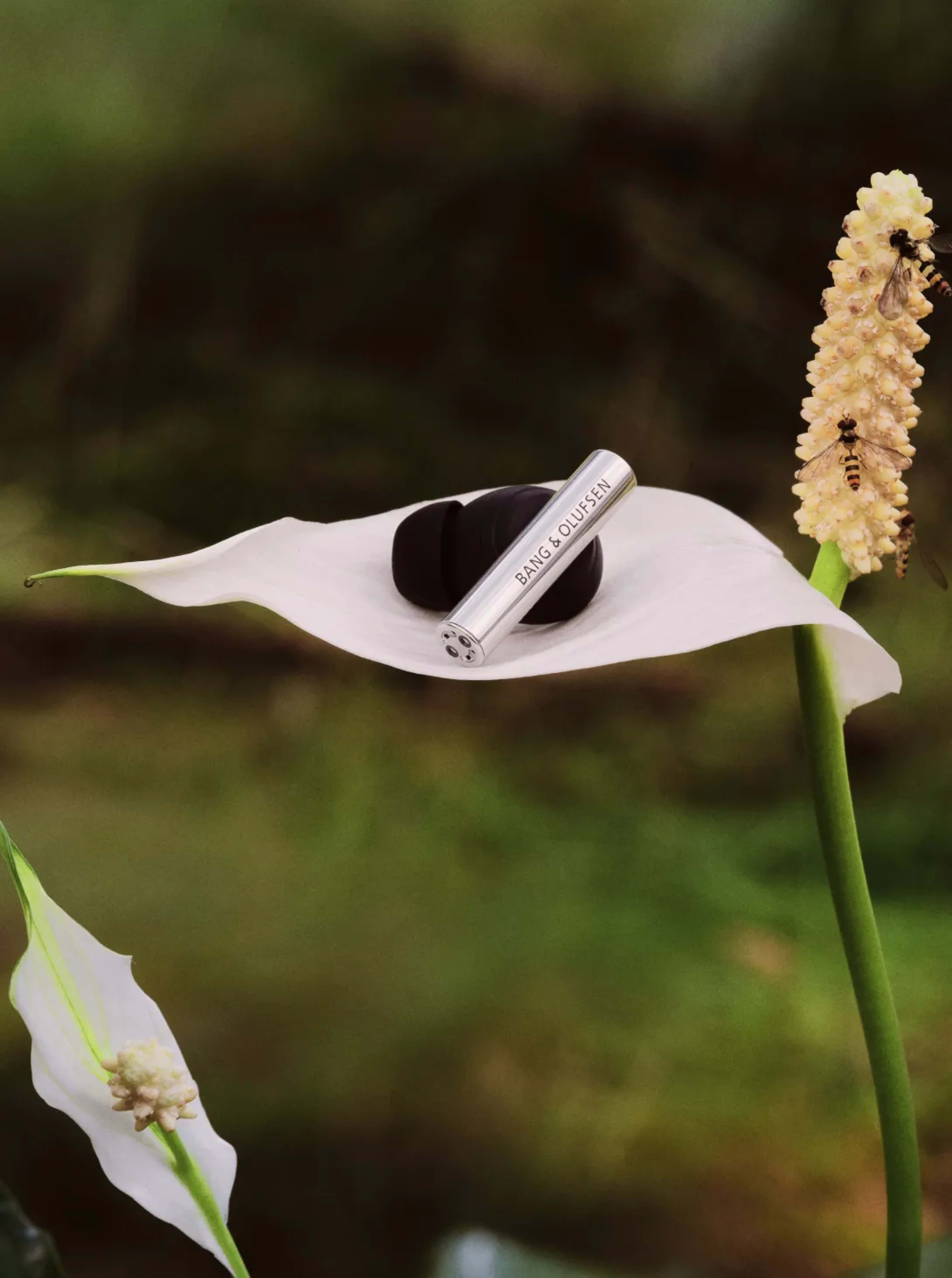 Super Hoodie earphone on a big flower leaf showing how light it is