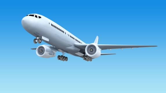 Aeroplane flying on blue backdrop