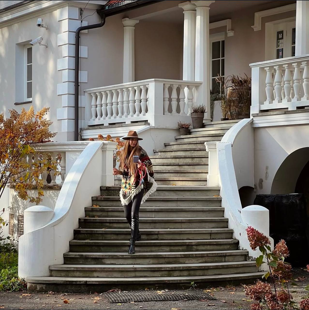 Fashion editorial in elegant architectural setting