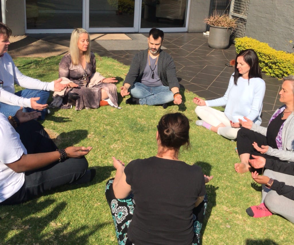 People meditating together