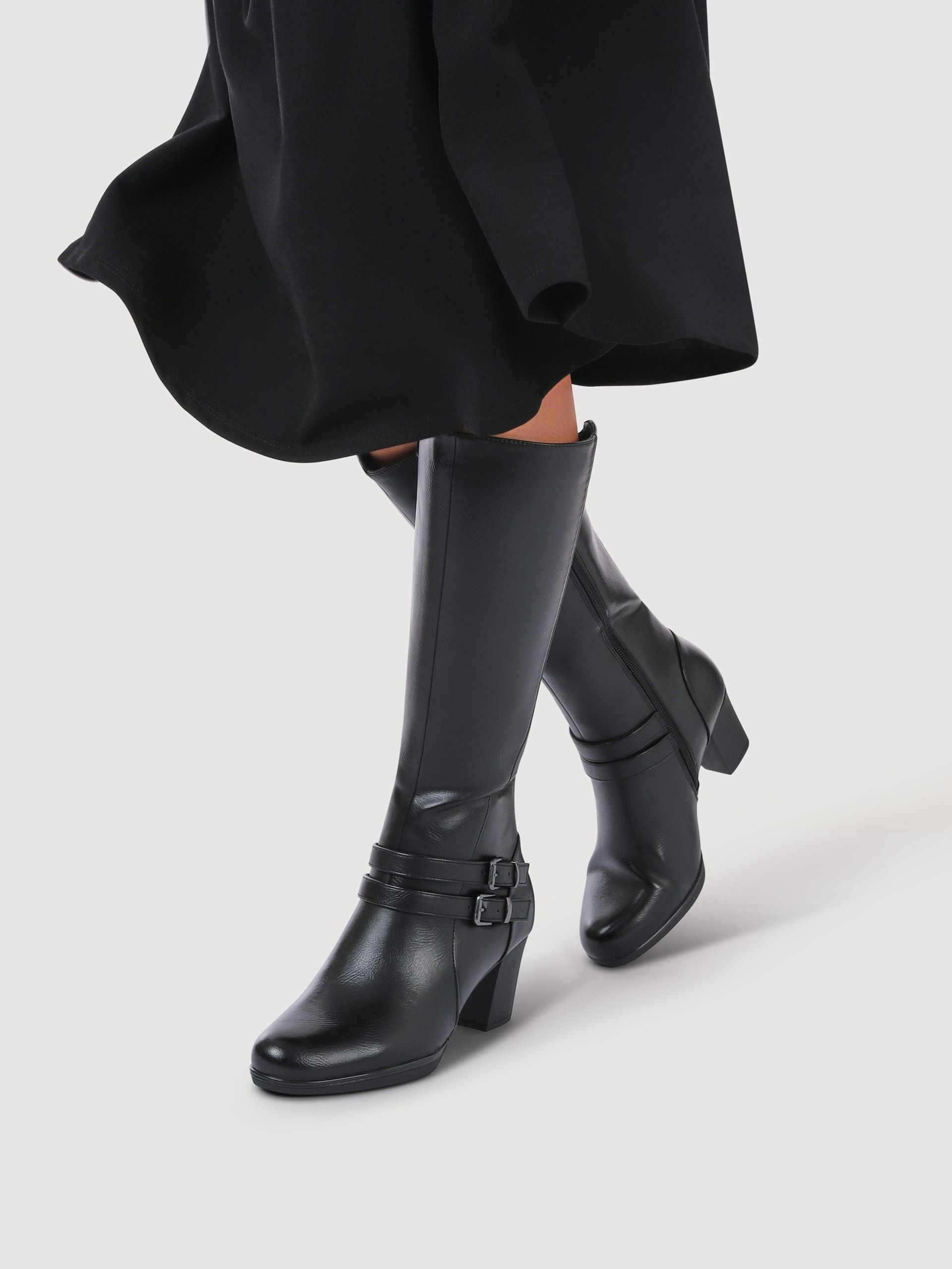 Black leather knee high boots lifestyle fashion shot - footwear product photography UK