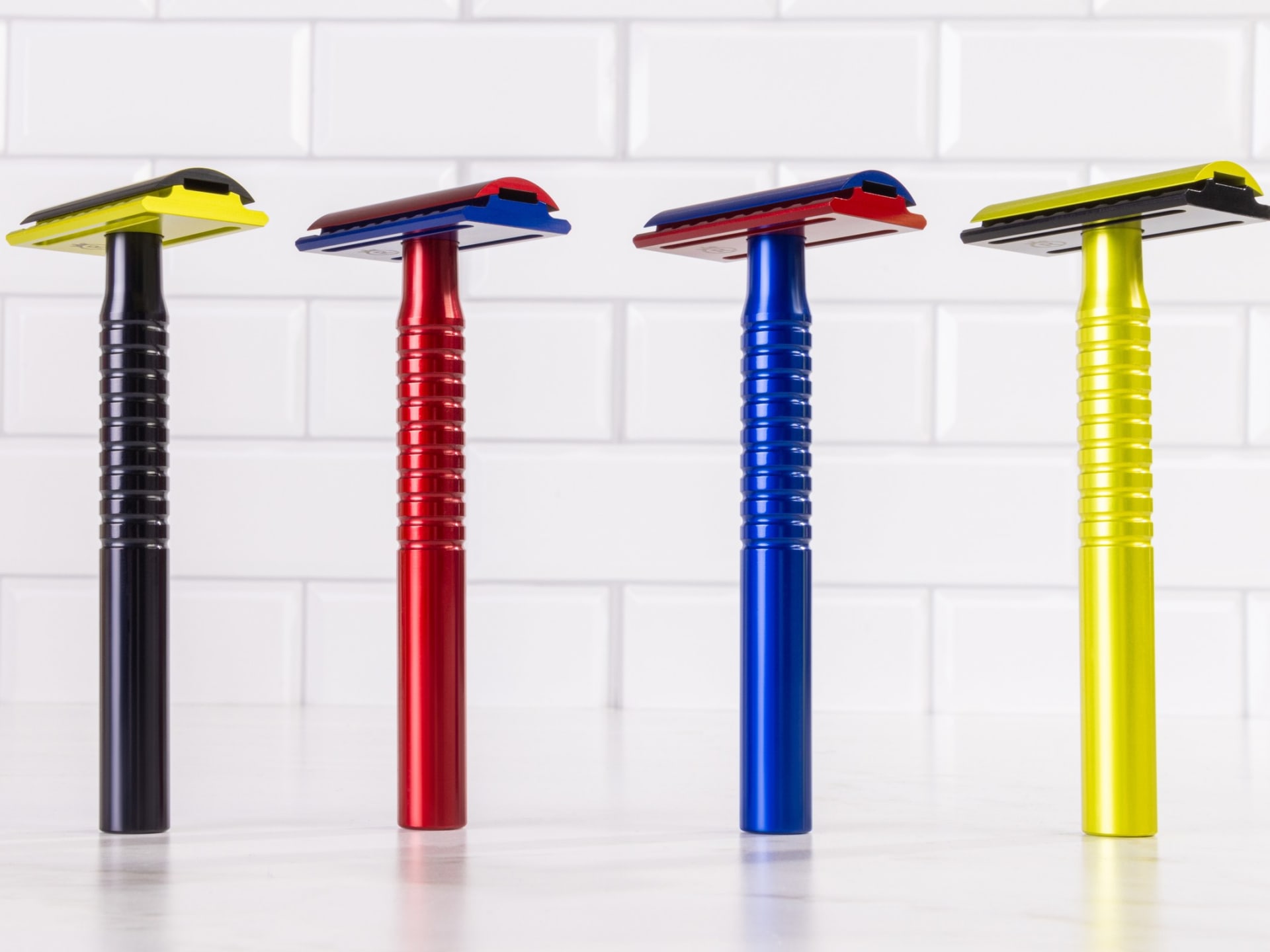 Colourful safety razors group packshot on white background - ecommerce product photography UK