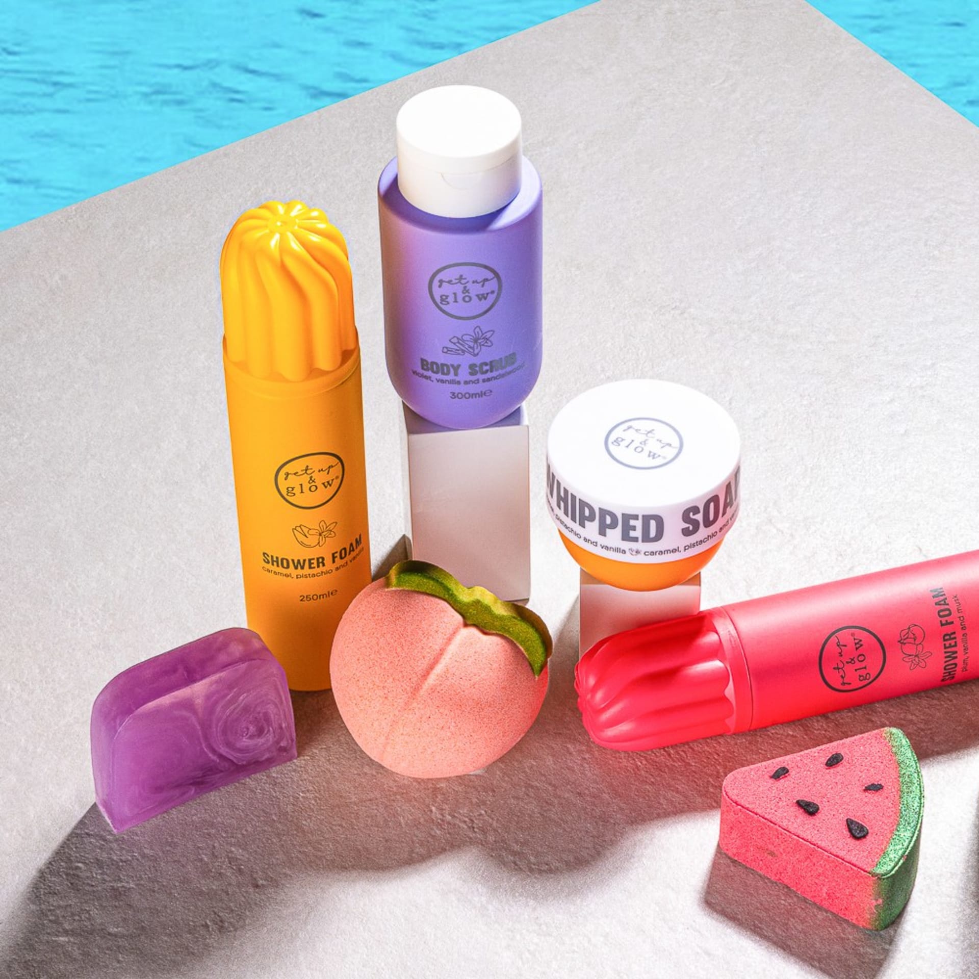 Colourful bath products poolside lifestyle - beauty photography UK