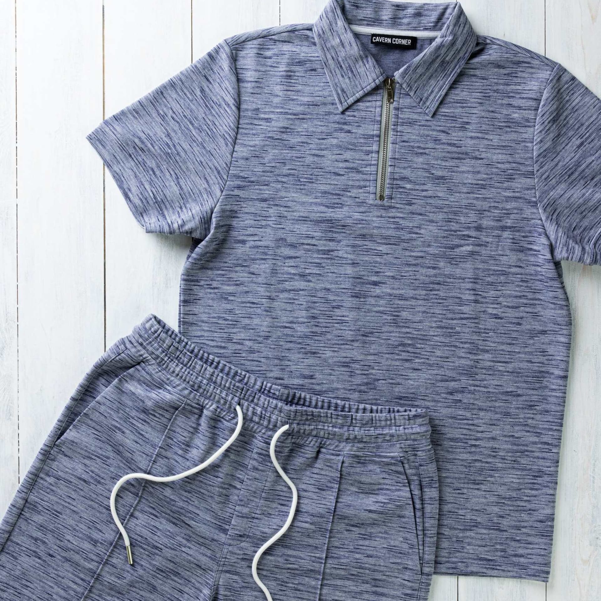 Mens blue marl polo and shorts set flat lay - clothing photography UK