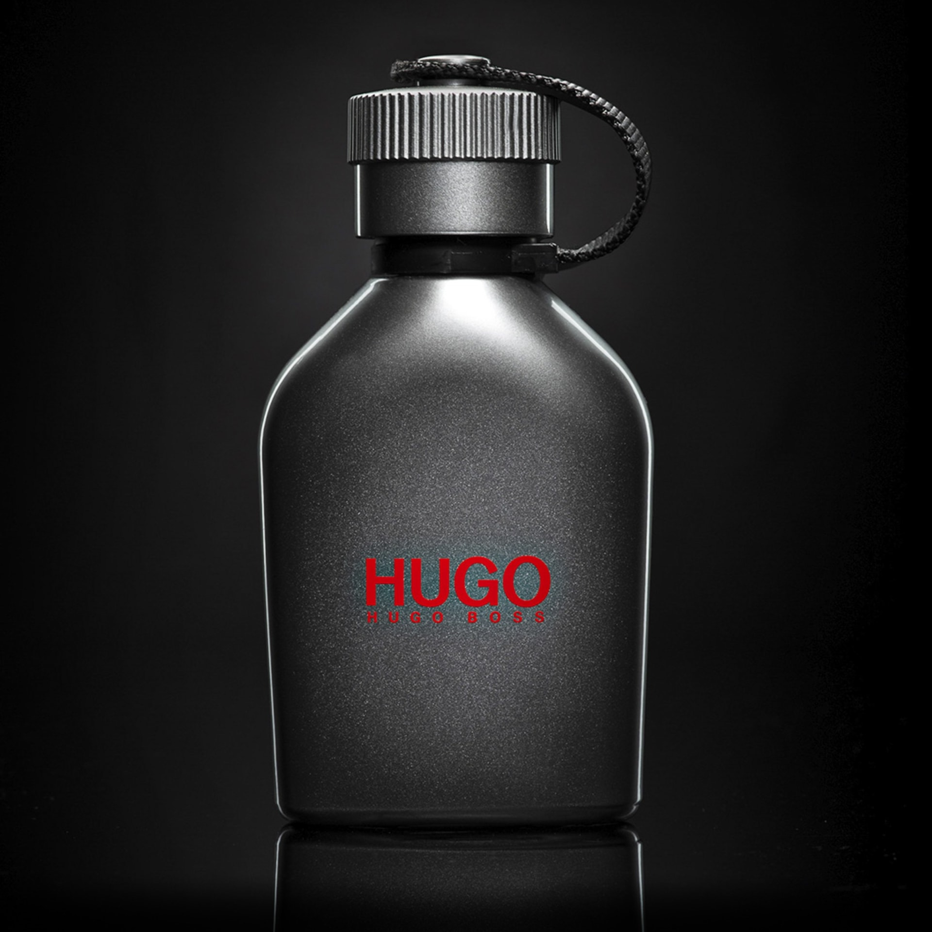 Mens fragrance bottle dark moody hero shot - product photography UK